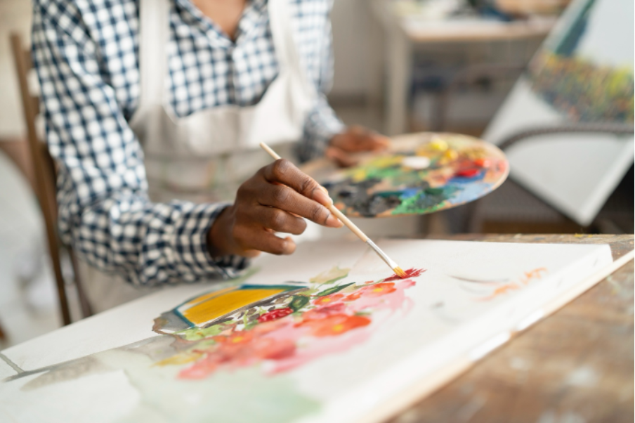 Woman painting and colourful flowers 